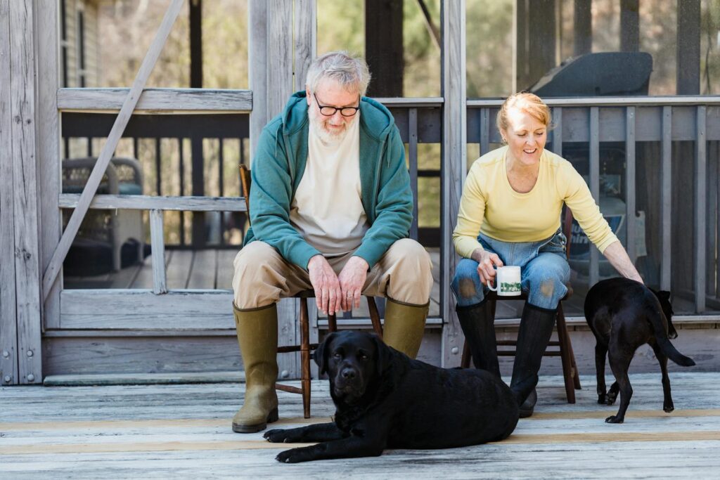 Elderly Couple Looking at Their Dogs - home care